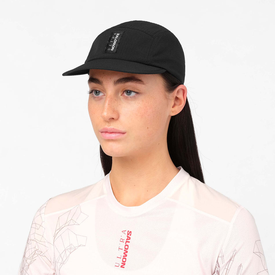 Front view of a model wearing the Salomon Unisex S/LAB Ultra Summer Cap in the Deep Black colourway.