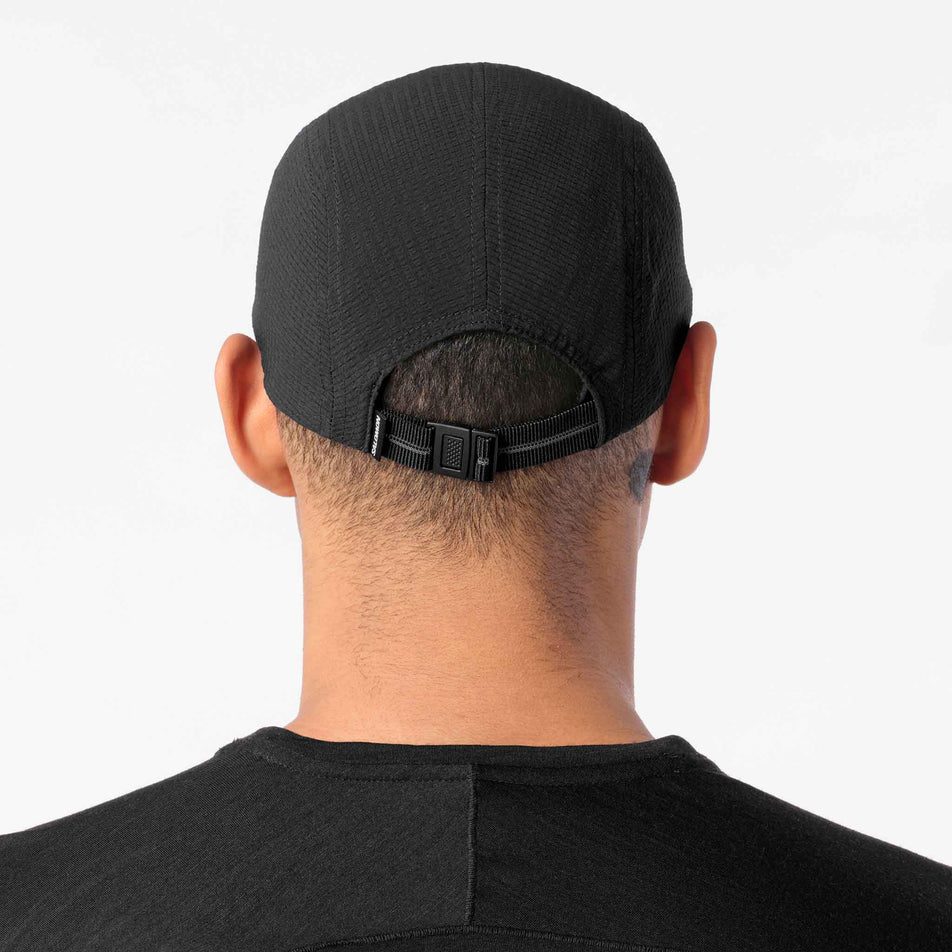 Back view of a model wearing the Salomon Unisex S/LAB Ultra Summer Cap in the Deep Black colourway.