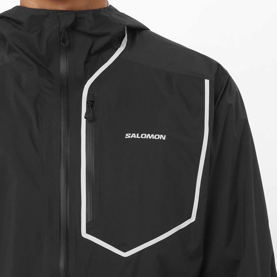 Front view of a model wearing the Salomon Men's Bonatti Pro Shell Jacket in the Deep Black colourway.