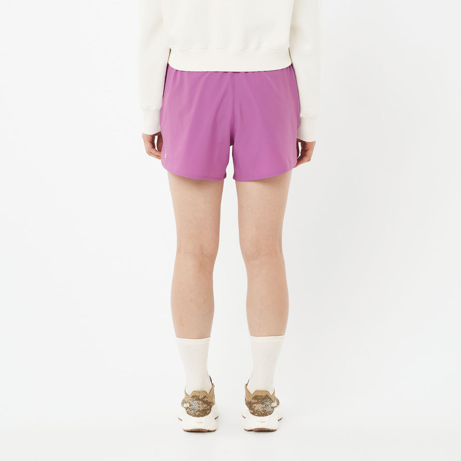 Back view of a model wearing the Salomon Women's Shakeout Core Shorts 4