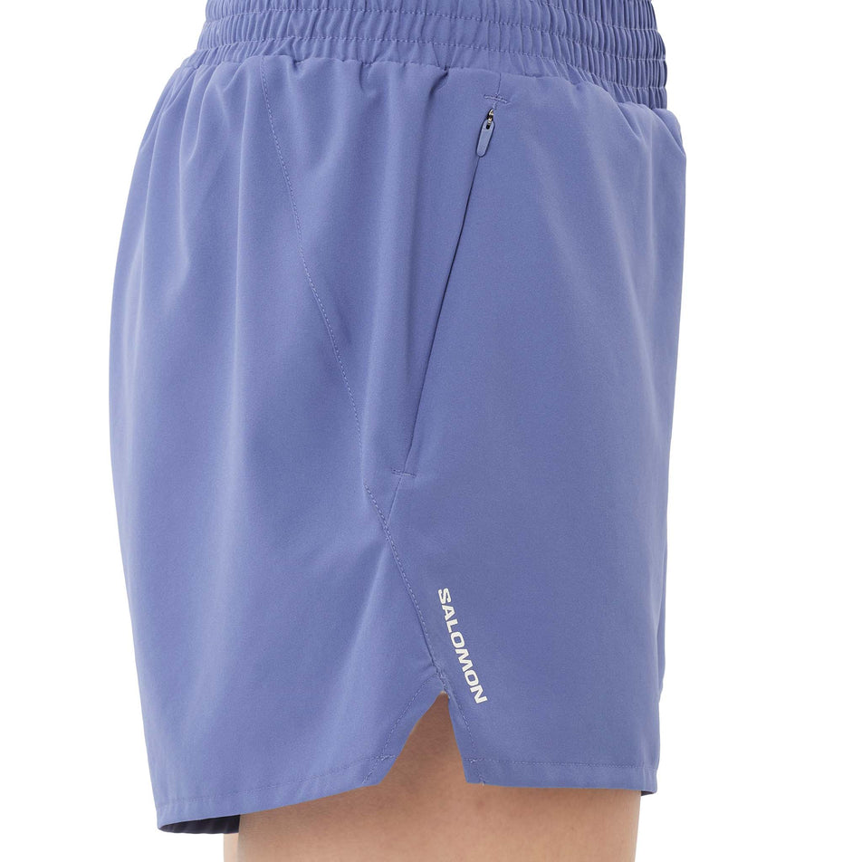 Side view of a model wearing the Salomon Women's SHKout Core Shorts 4