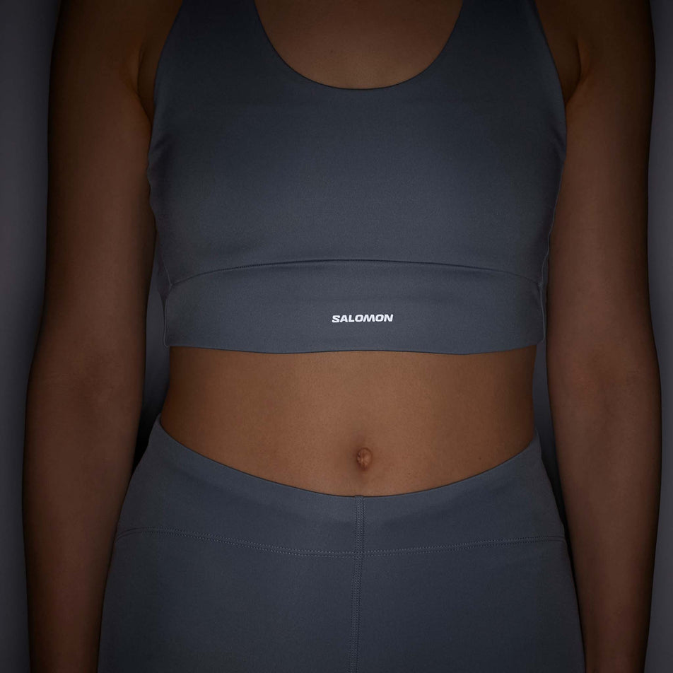 Front view of a model wearing the Salomon Women's SHKout CORE Sports Bra in the Trade Winds colourway.