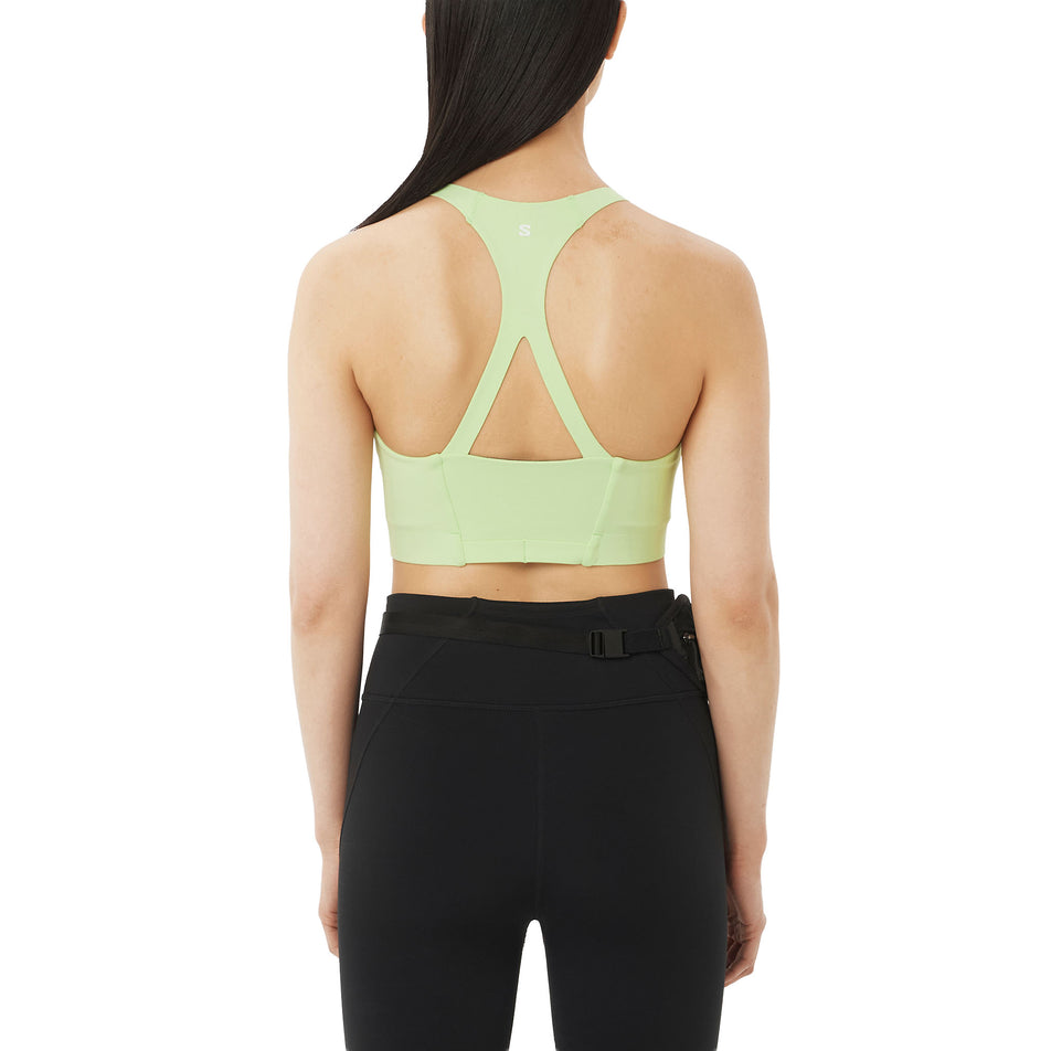Back view of a model wearing the Salomon Women's SHKout Bliss Bra in the Butterfly colourway.