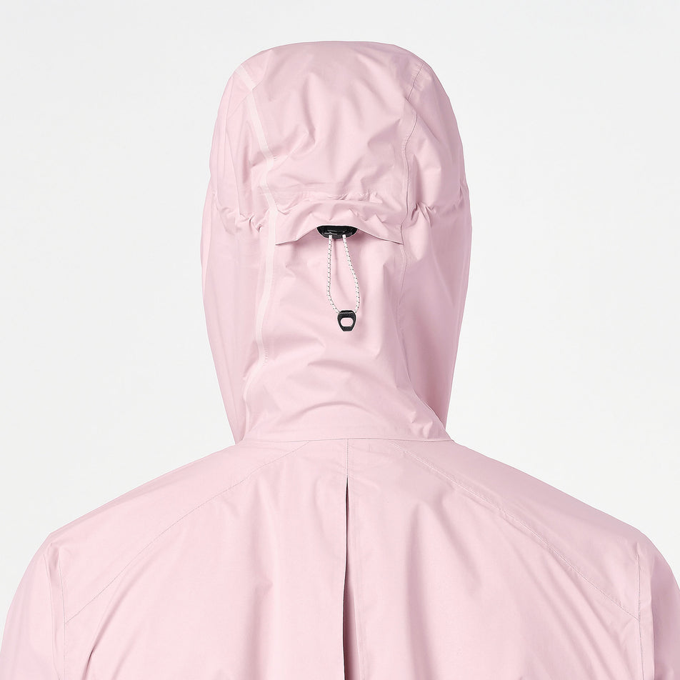 Back view of a model wearing the Salomon Women's Bonatti Pro Shell Jacket in the Icy Pink colourway.