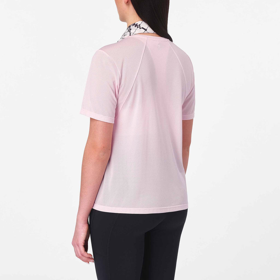 Back view of a model wearing the Salomon Women's Shakeout Core SS Tee in the Icy Pink colourway.