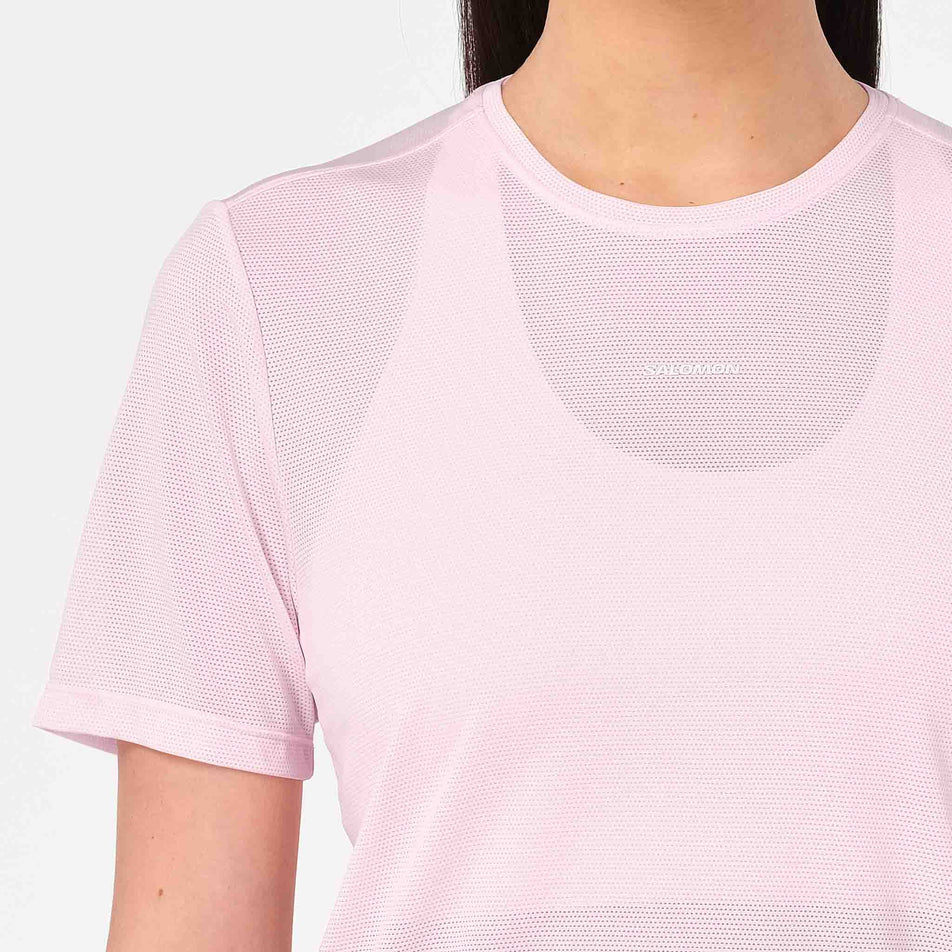 Front view of a model wearing the Salomon Women's Shakeout Core SS Tee in the Icy Pink colourway.