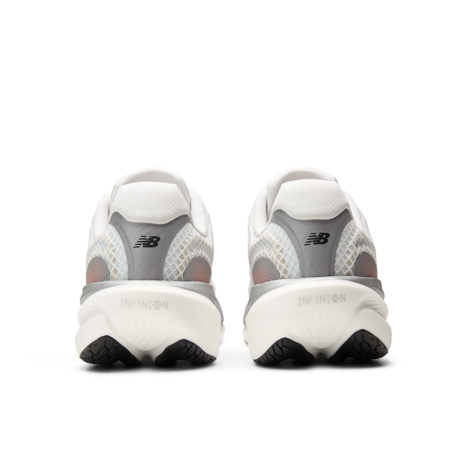The back of a pair of New Balance Men's 1080 V15 Running Shoes in the White/Pink Heat colourway.