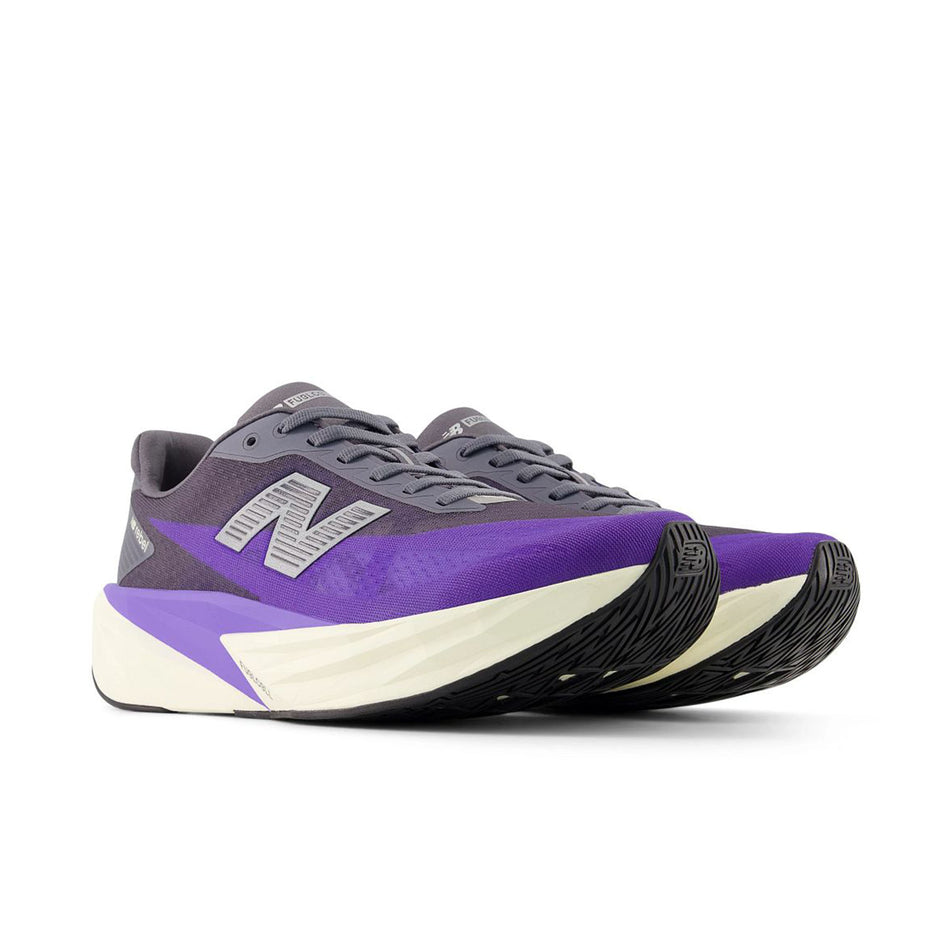 A pair of New Balance Men's Fuelcell Rebel V5 Running Shoes in the Electric Indigo/Truffle Salt colourway.