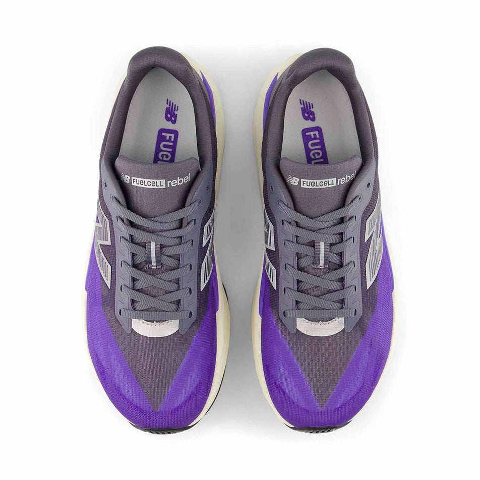 The uppers of a pair of New Balance Men's Fuelcell Rebel V5 Running Shoes in the Electric Indigo/Truffle Salt colourway.
