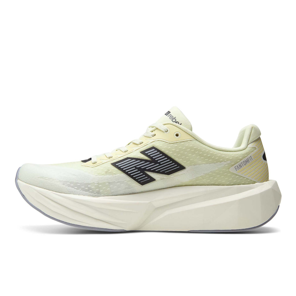 Medial view of the right shoe from a pair of New Balance Men's Fuelcell Rebel V5 Running Shoes in the Pistachio Butter/Digital Mist colourway.