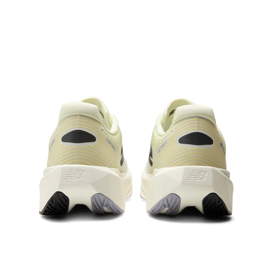 The back of a pair of New Balance Men's Fuelcell Rebel V5 Running Shoes in the Pistachio Butter/Digital Mist colourway.