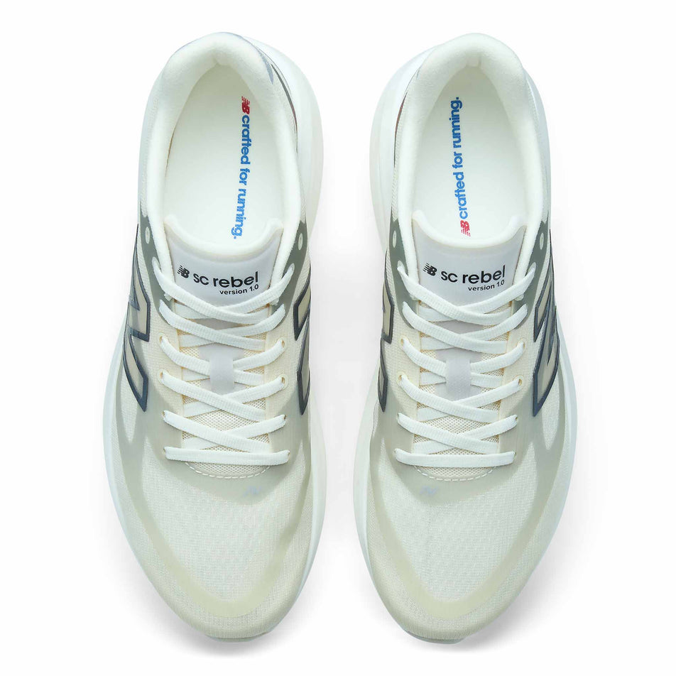 The uppers of a pair of New Balance Men's SC Rebel Running Shoes in the Angora/Slate Grey colourway. 