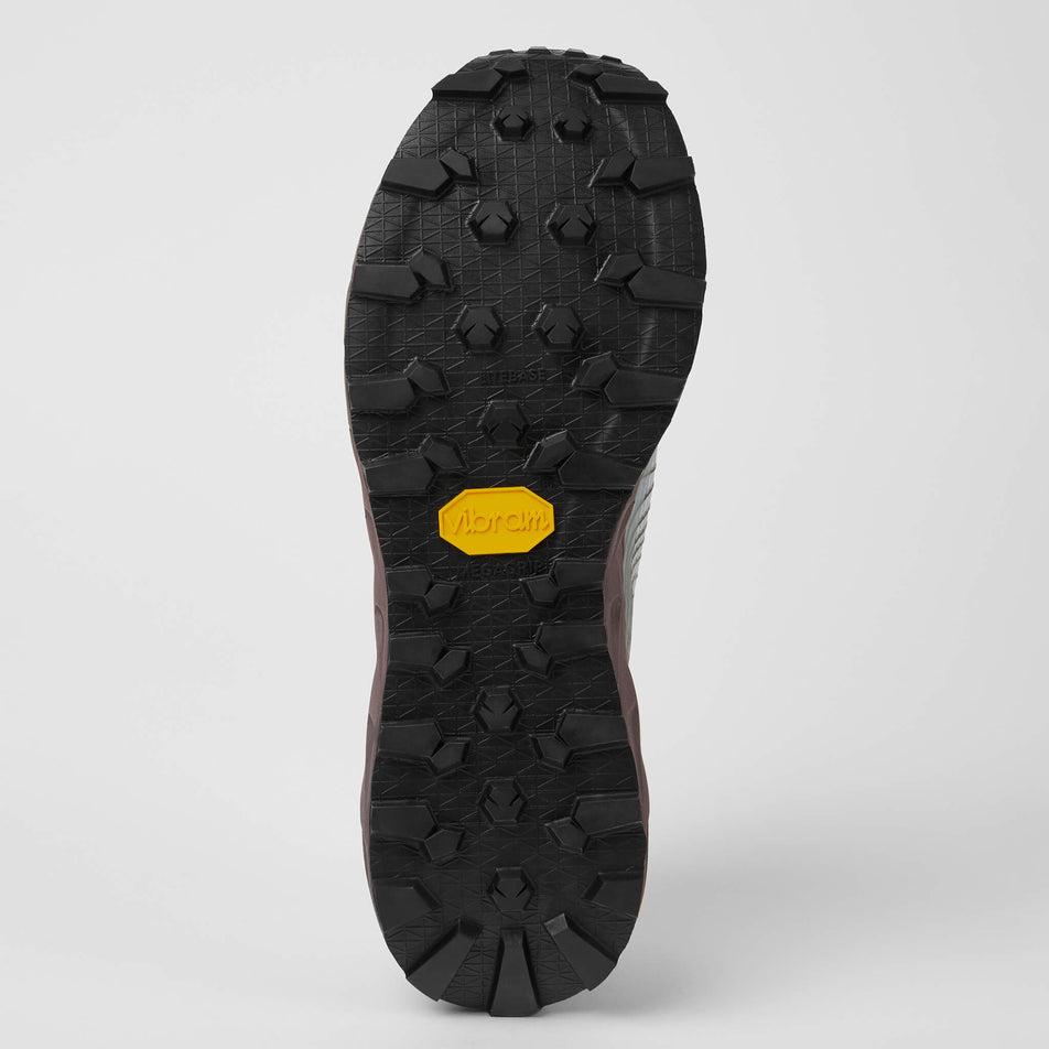 The outsole of the right shoe from a pair of NNormal Unisex Tomir Trail Running Shoes in the grey/purple colourway (7965392797858)