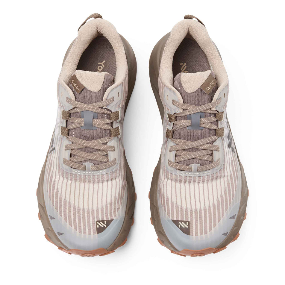 The uppers of a pair of NNormal Men's Cadí Running Shoes in the Brown colourway.