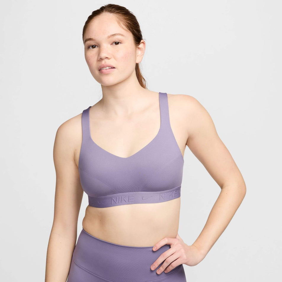 Front view of a model wearing a Nike  Women's Indy High Support Padded Adjustable Sports Bra in the Daybreak/Daybreak colourway.  (8215845961890)