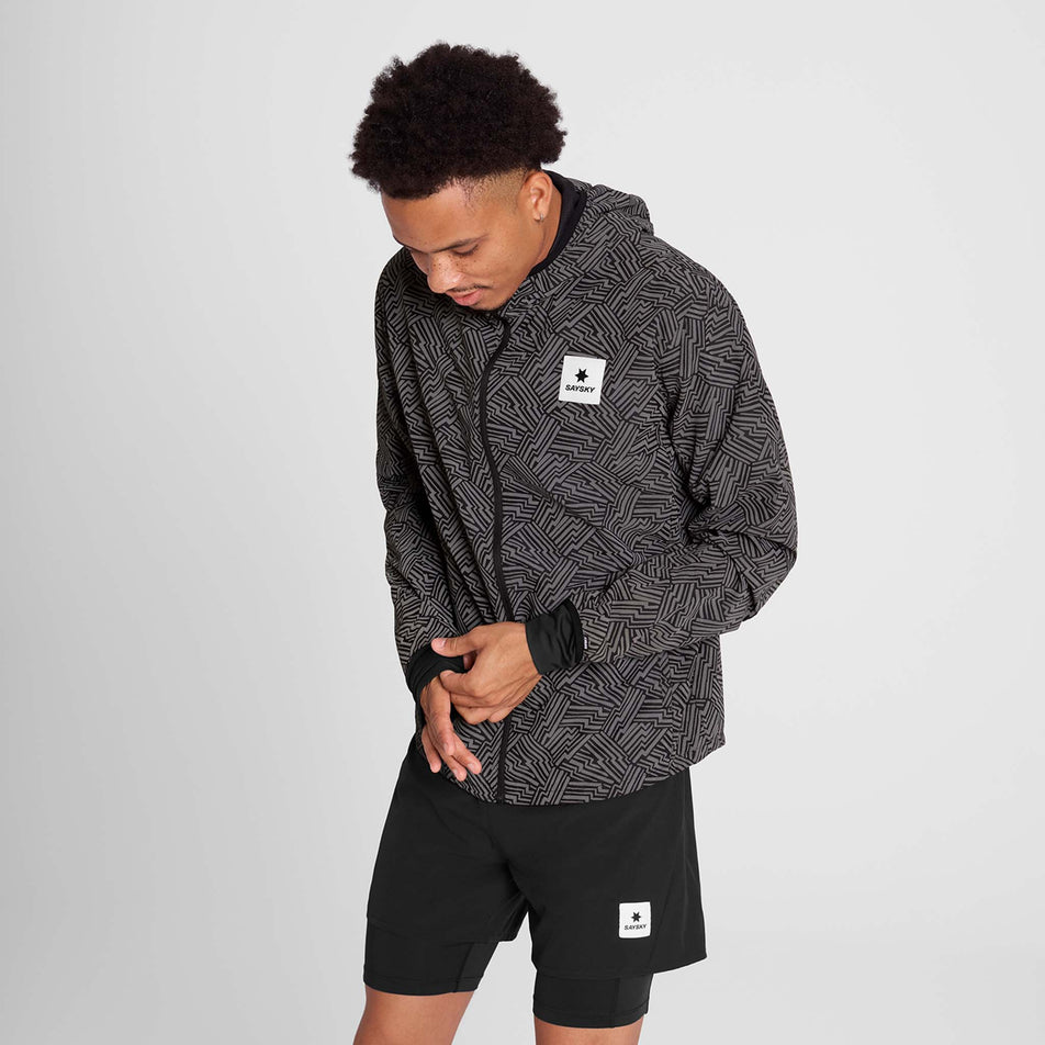 Front view of a model wearing the SAYSKY Men's Reflective Blaze Jacket in the Black colourway. (8787878084770)