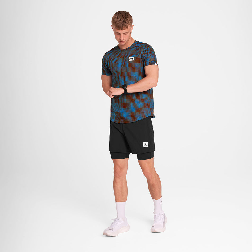Front view of a model wearing the SAYSKY Men's Houndstooth Combat T-Shirt in the Blue AOP colourway. Model is also wearing shorts, socks and shoes. (8756486439074)