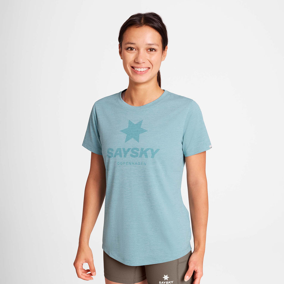 Front view of a model wearing the SAYSKY Women's Logo Combat Pro T-Shirt in the Blue colourway.