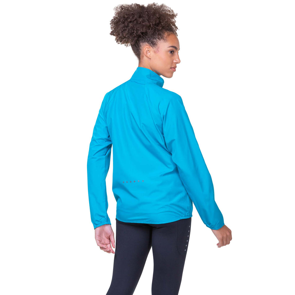 Back view of a model wearing a Ronhill Women's Core Jacket in the Azure/Bright White colourway. Model is also wearing Ronhill running leggings. (8159243108514)