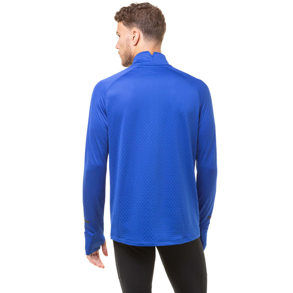 Back view of a model wearing a Ronhill Men's Tech Prism 1/2 Zip Tee in the Cobalt/Flame colourway. Model is also wearing a pair of black Ronhill running tights. (8032256393378)
