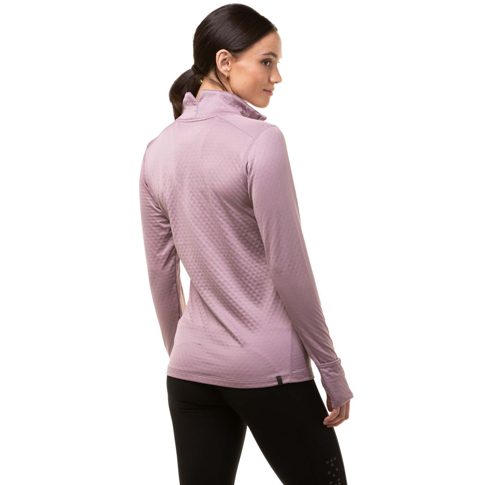 Back view of a model wearing a Ronhill Women's Tech Prism 1/2 Zip Tee in the Stardust/Woodland colourway.  (8024365531298)