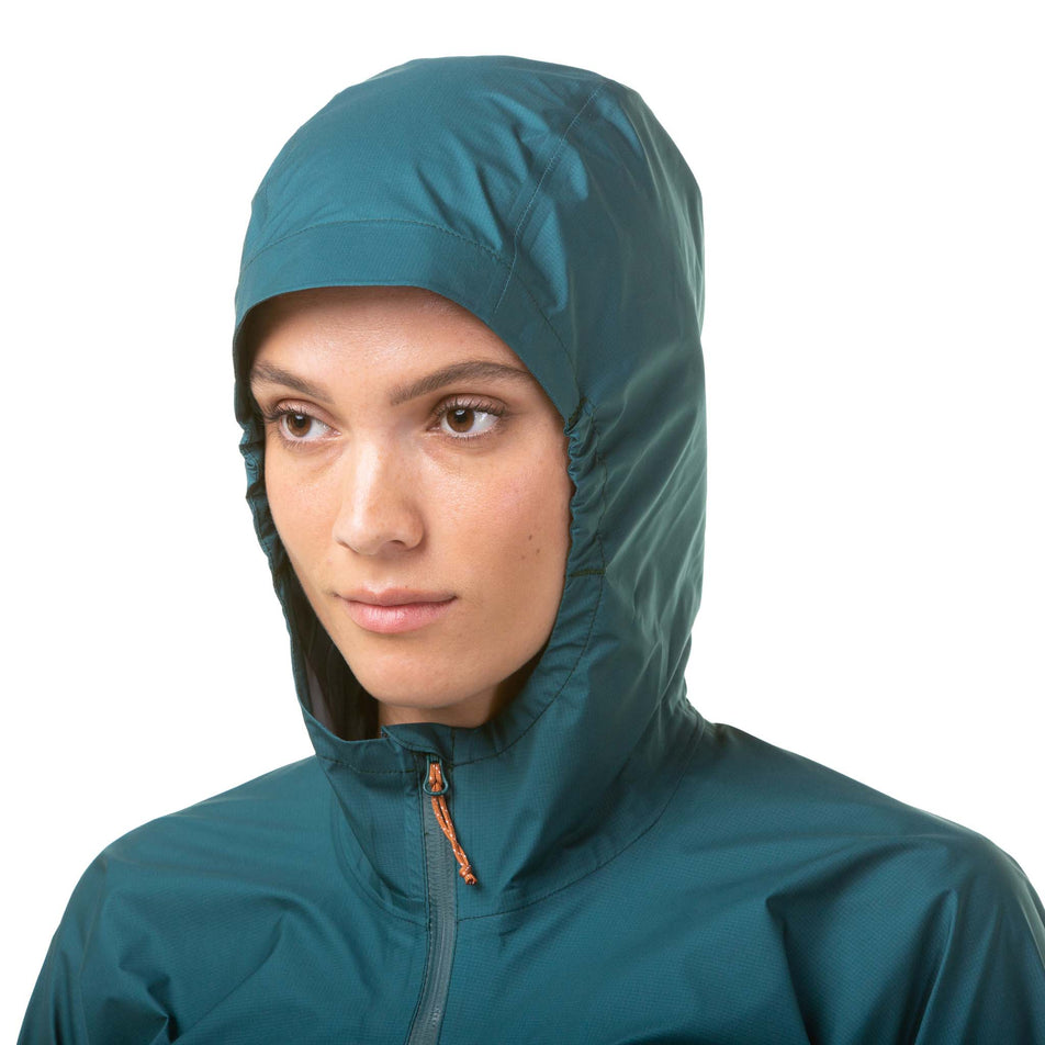 A model wearing a Ronhill Women's Gore-Tex Mercurial Jacket with the hood up. Only the upper part of the jacket is visible in the image.  (8059839119522)