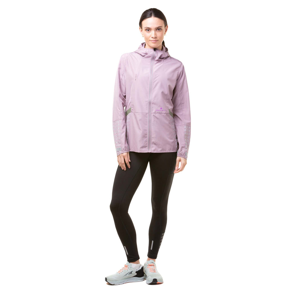 Front view of a model wearing a Ronhill Women's Tech Afterhours Jacket in the Stardust/Thistle/Reflect colourway. (8019199557794)