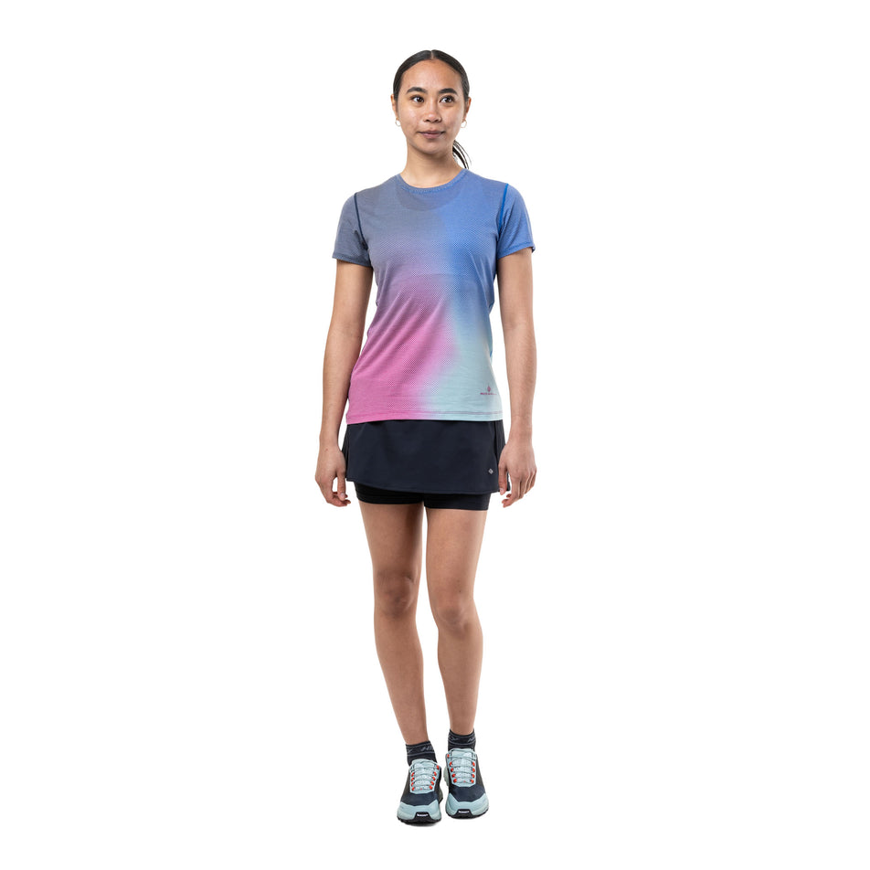 Front view of a model wearing the Ronhill Women's Tech Golden Hour S/S Tee in the Exuberance Merge colourway.