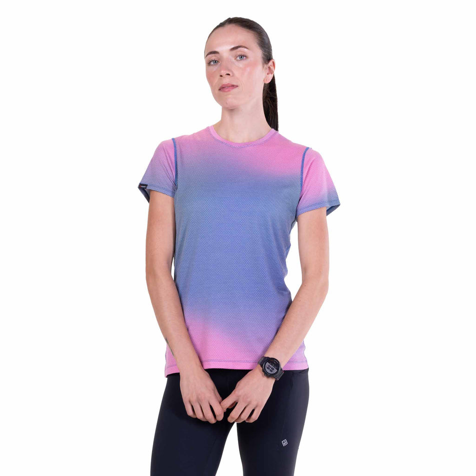 Front view of a model wearing the Ronhill Women's Tech Golden Hour S/S Tee in the Orchid Glow colourway.