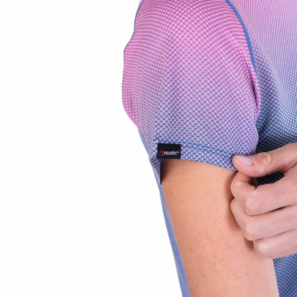 Close-up view of the sleeve of the Ronhill Women's Tech Golden Hour S/S Tee in the Orchid Glow colourway.
