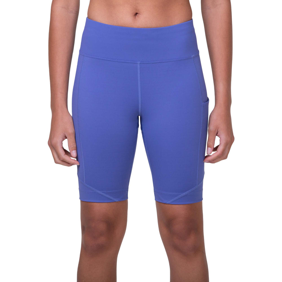 Front view of a model wearing the Ronhill Women's Tech Stretch Short in the Dark Periwinkle/Aquamint colourway (8158831575202)