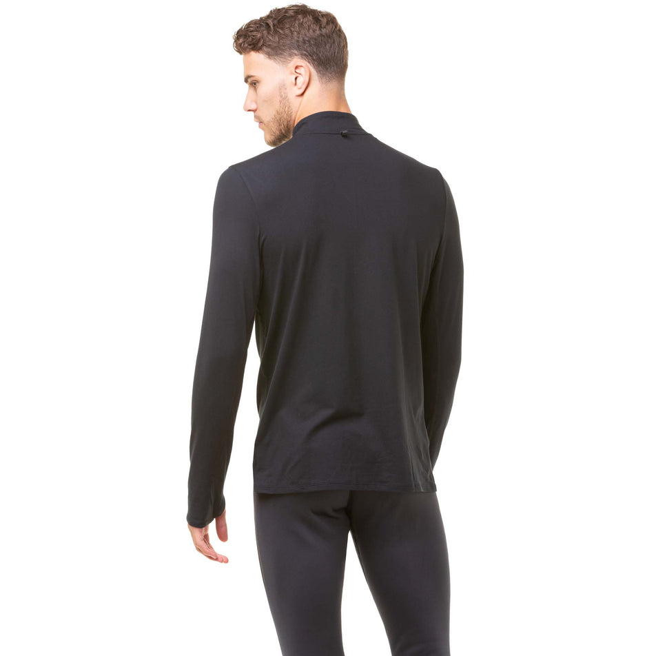 Back view of model wearing a Ronhill Men's Core Thermal 1/2 Zip in the Black/Bright White colourway. Model is also wearing black Ronhill running tights. (8032268517538)