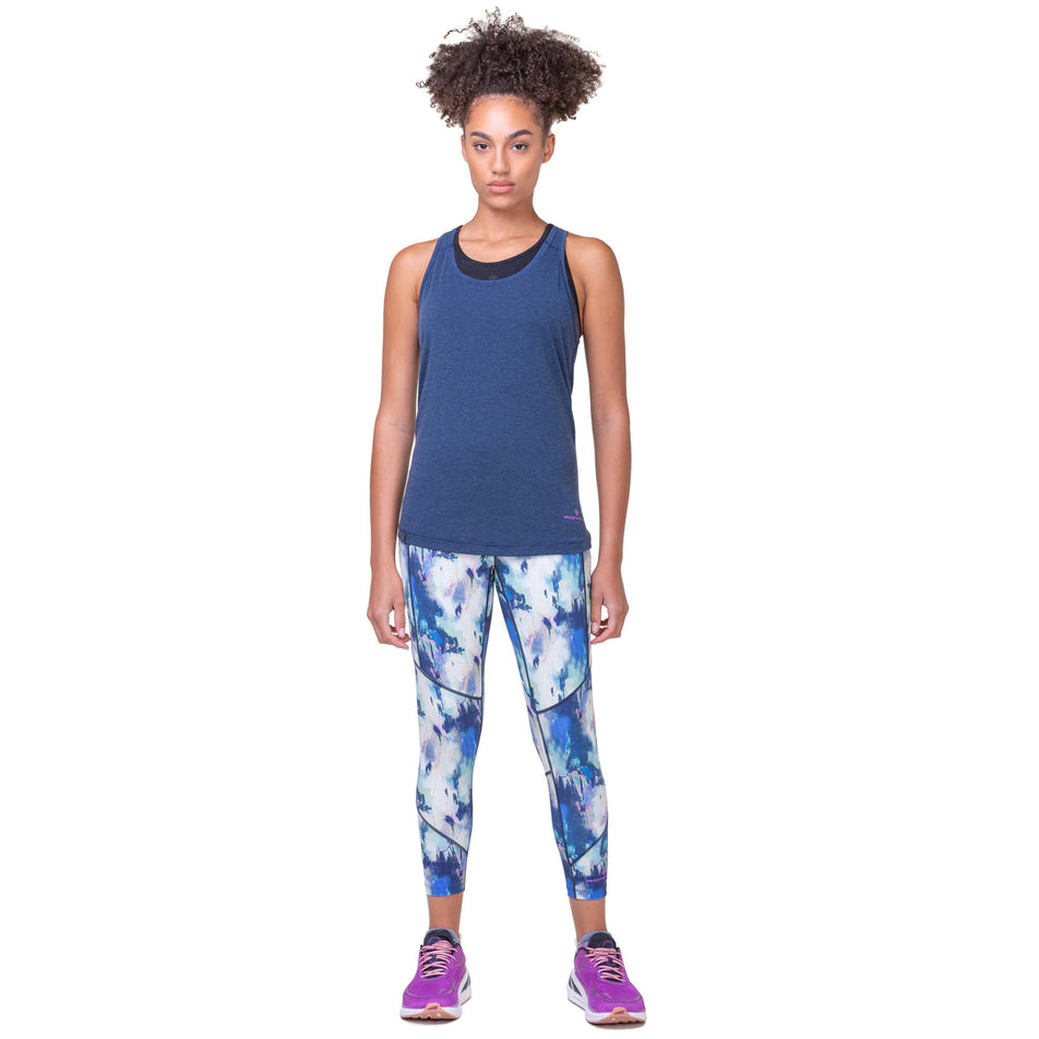 Front view of a model wearing a Ronhill Women's Tech Tencel Vest in the Dark Navy Marl colourway. Model is also wearing Ronhill leggings and Altra running shoes. (8159377424546)