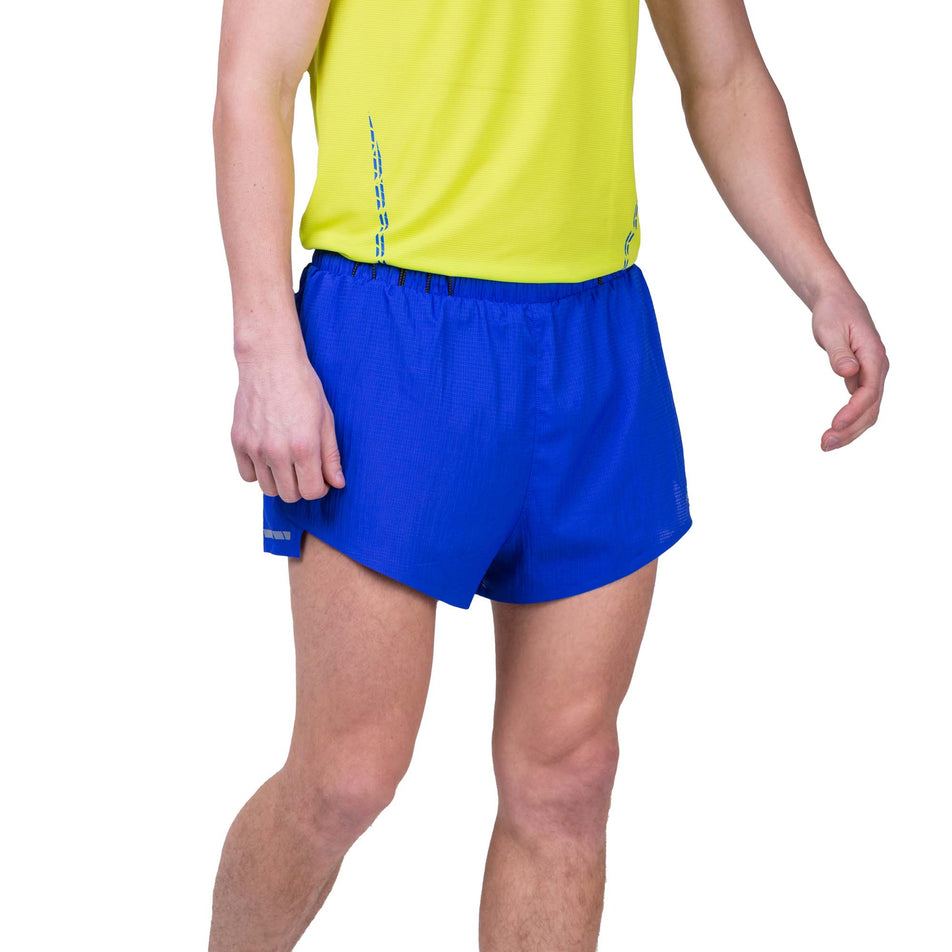 Front view of a model wearing the Ronhill Men's Tech Race Short in the Azurite/Citrus colourway. Model is also wearing a Ronhill running vest. (8159260410018)