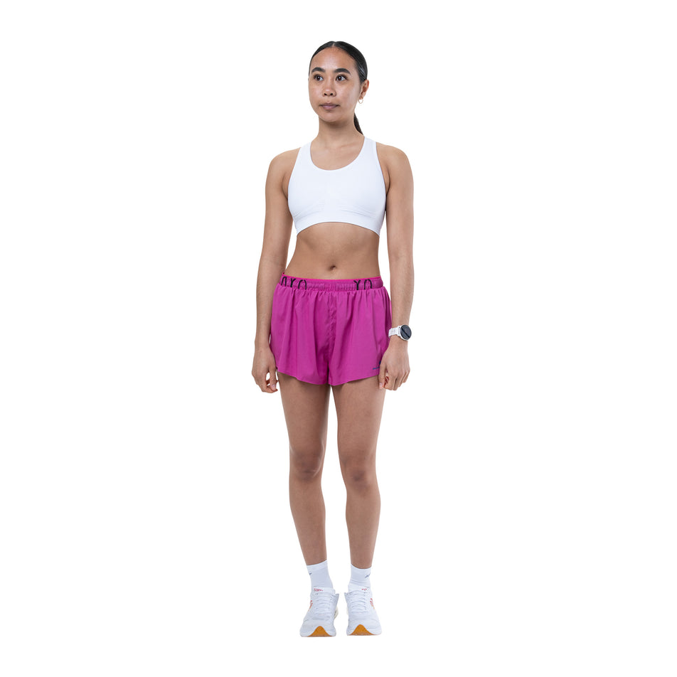 Front view of a model wearing the Ronhill Women's Tech Race Short in the Exuberance/Classic Blue colourway.