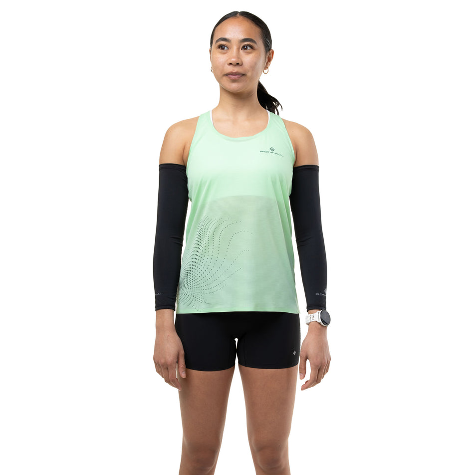 Front view of a model wearing the Ronhill Women's Tech Race Vest in the Seafoam/Laurel colourway.