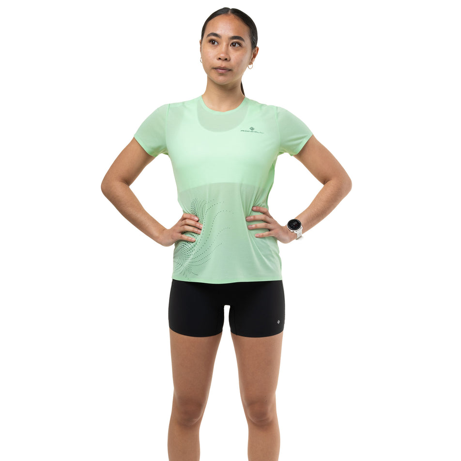 Front view of a model wearing the Ronhill Women's Tech Race S/S Tee in the Seafoam/Laurel colourway.