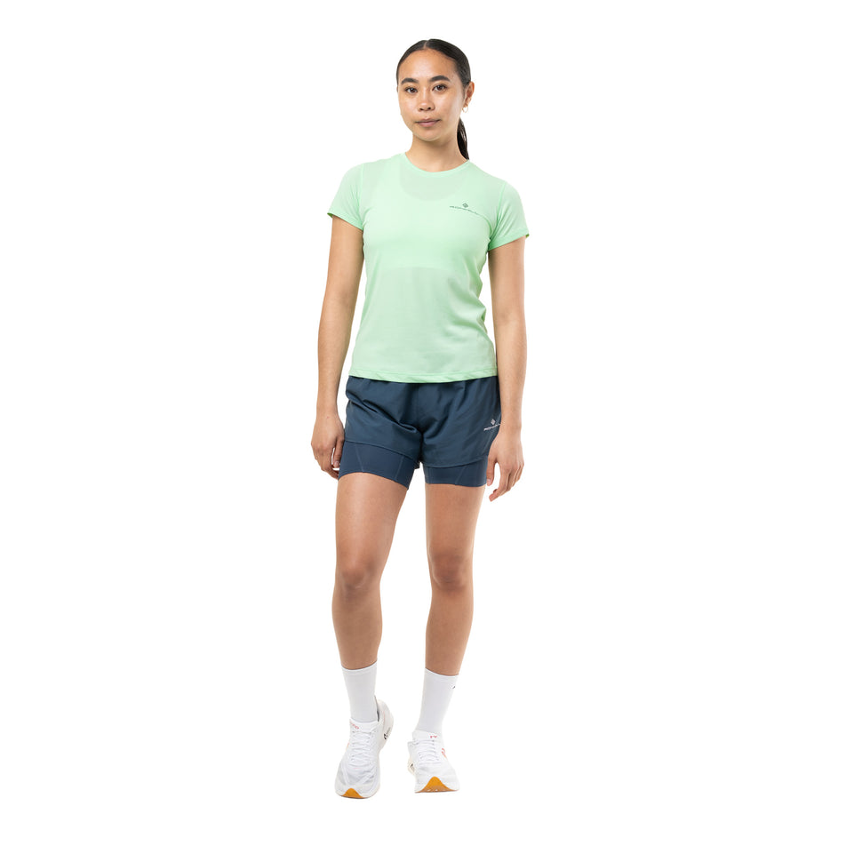 Front view of a model wearing the Ronhill Women's Core S/S Tee in the Seafoam/Laurel colourway.