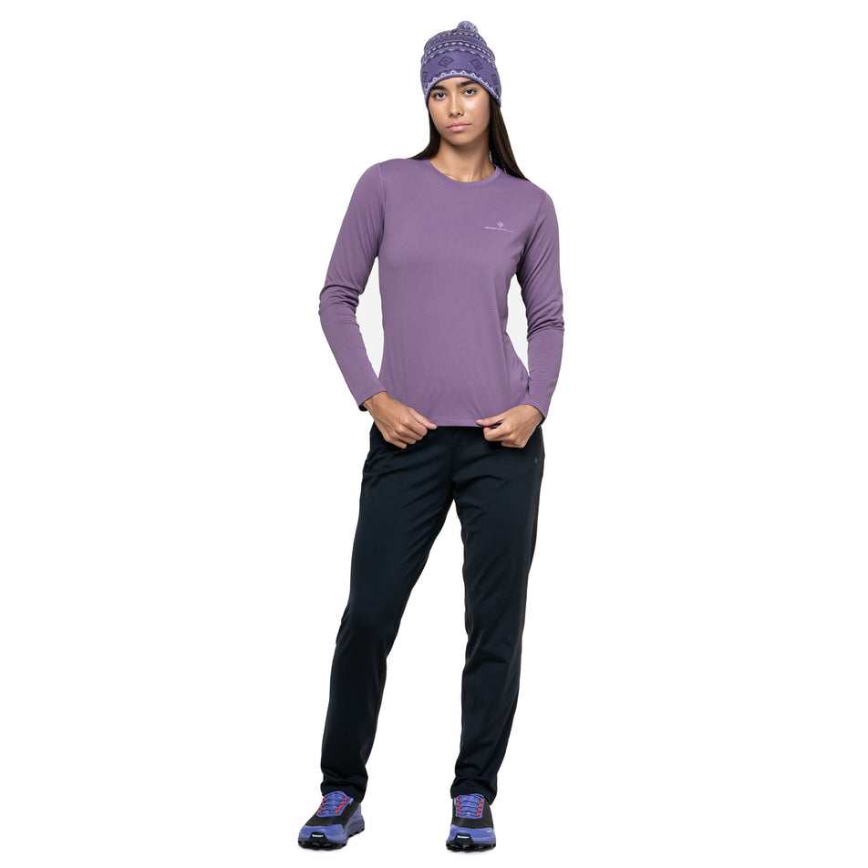 Front view of a model wearing the Ronhill Women's Core L/S Tee in the Dark Iris/Iris colourway. (8742760022178)