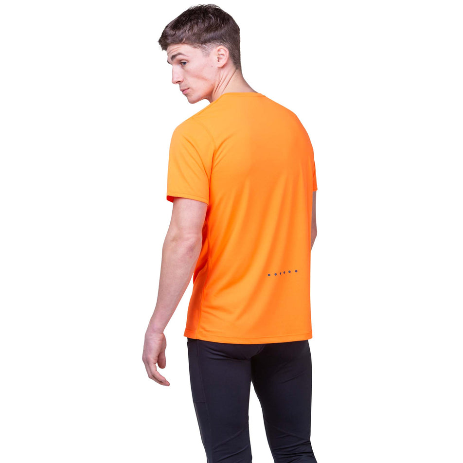 Back view of a model wearing the Ronhill Men's Core S/S Tee in the Fluo Orange/Legion colourway. Model is also wearing Ronhill tights. (8160893599906)