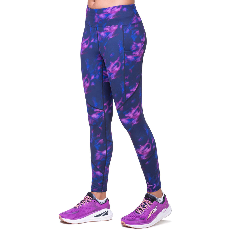 Front view of a model wearing the Ronhill Women's Tech Tight in the Dark Navy Blur colourway. Model is also wearing Altra running shoes. (8171499061410)
