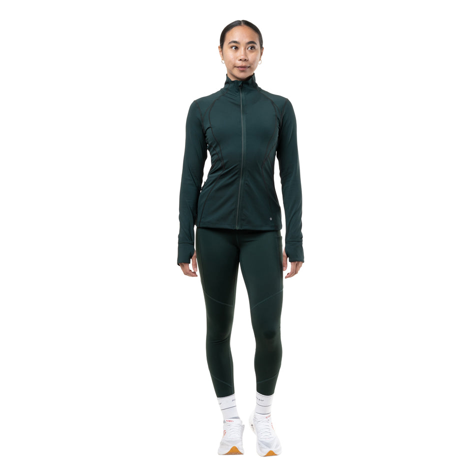 Front view of a model wearing the Ronhill Women's Tech Tight in the Dark Laurel colourway.