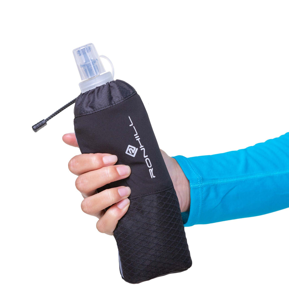 A model holding a Ronhill Hand-held 470ml Fuel Flask (8160977420450)