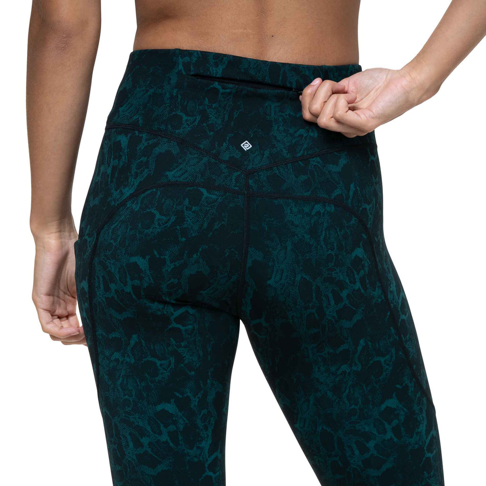 The zip pocket on the back of the Ronhill Women's Tech Crop Tight in the Seaweed Medusa colourway. (8747588911266)