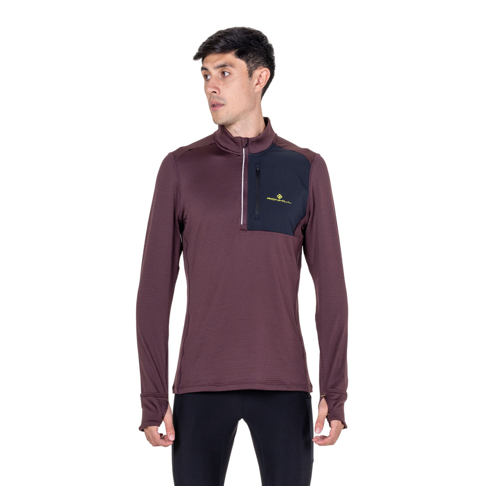 Front view of a model wearing the Ronhill Men's Tech Winter 1/2 Zip in the Espresso/Black colourway.