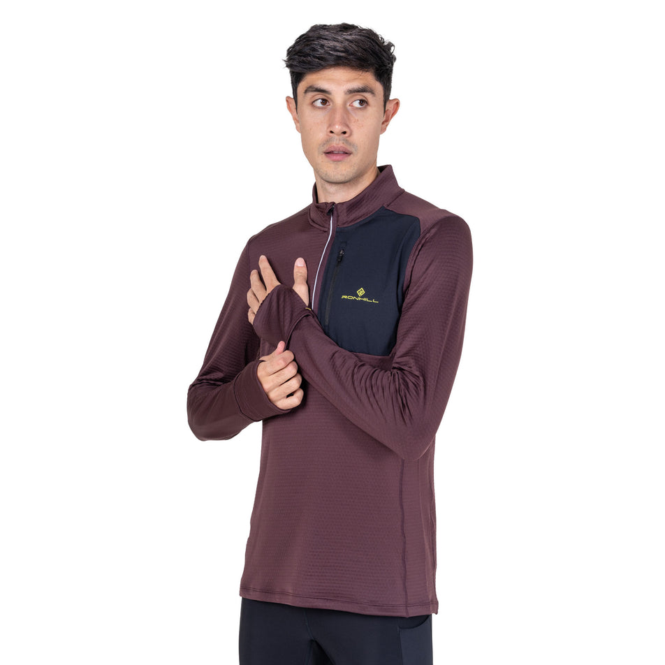 Front view of a model wearing the Ronhill Men's Tech Winter 1/2 Zip in the Espresso/Black colourway.