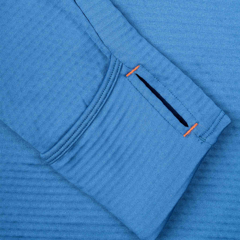 Close-up view of the thumb loop on the Ronhill Men's Tech Winter 1/2 Zip in the Glacier/Oxide colourway.