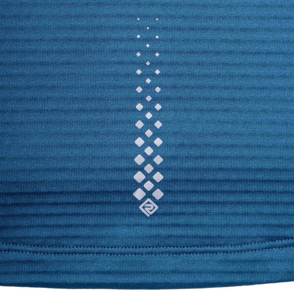 Close-up view of the reflective print on the Ronhill Women's Tech Winter 1/2 Zip in the Legion Blue/Orchid colourway.