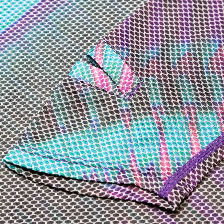 Close-up view of the Ronhill Women's Tech Golden Hour L/S Tee's fabric. (8490067361954)