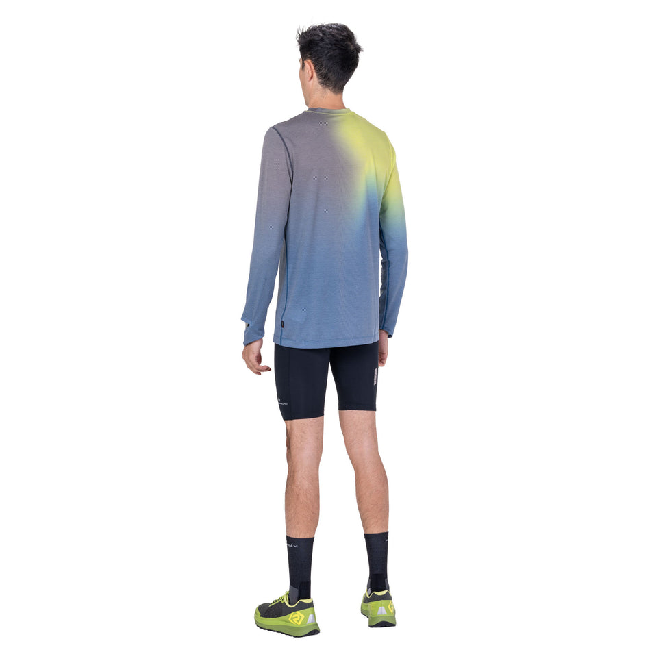 Back view of a model wearing the Ronhill Men's Tech Golden Hour L/S Tee in the Glacier Merge colourway.